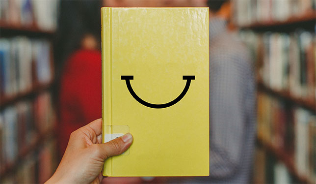 Book with a smiley face.